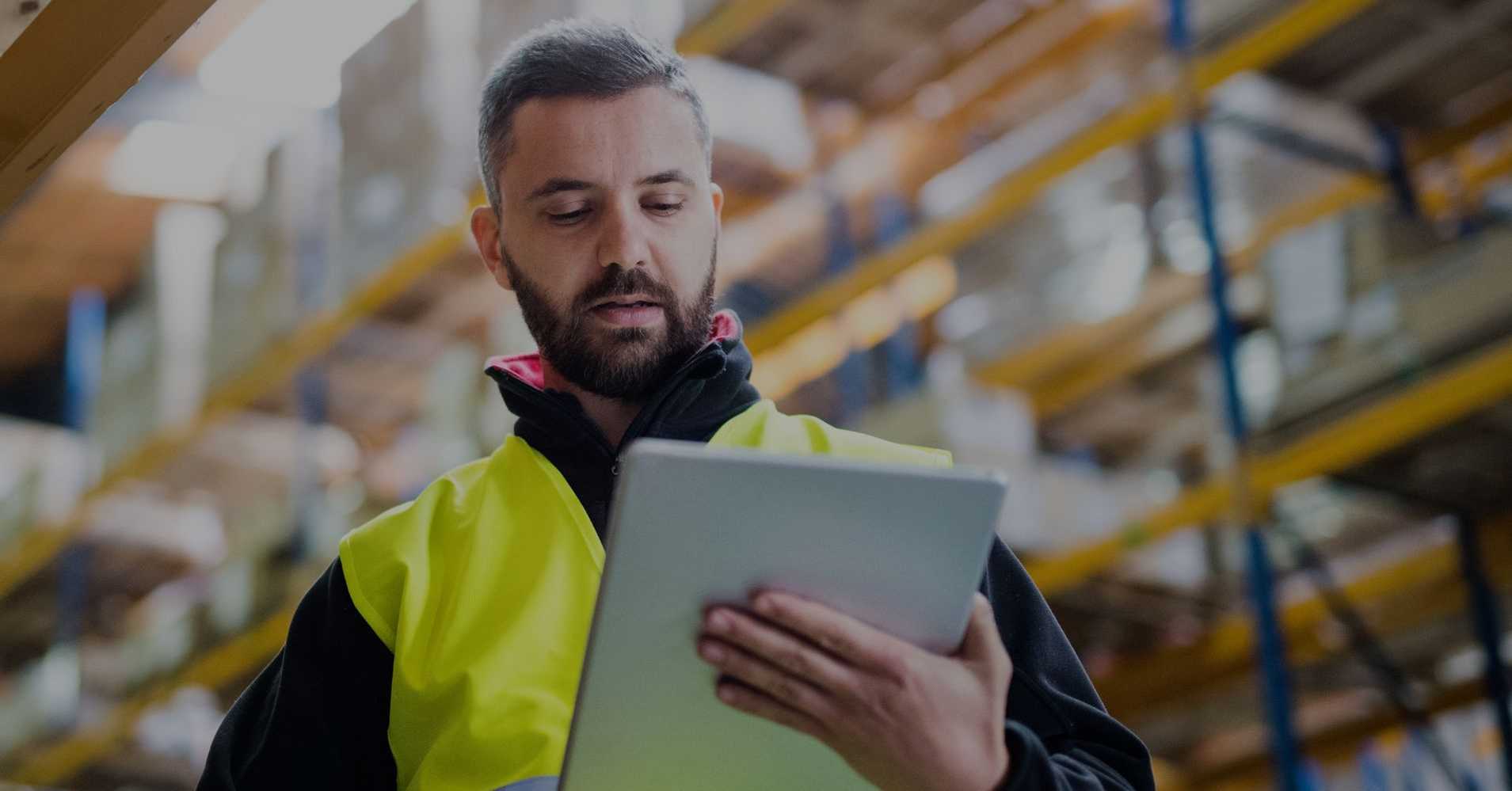 safety worker looking at tablet