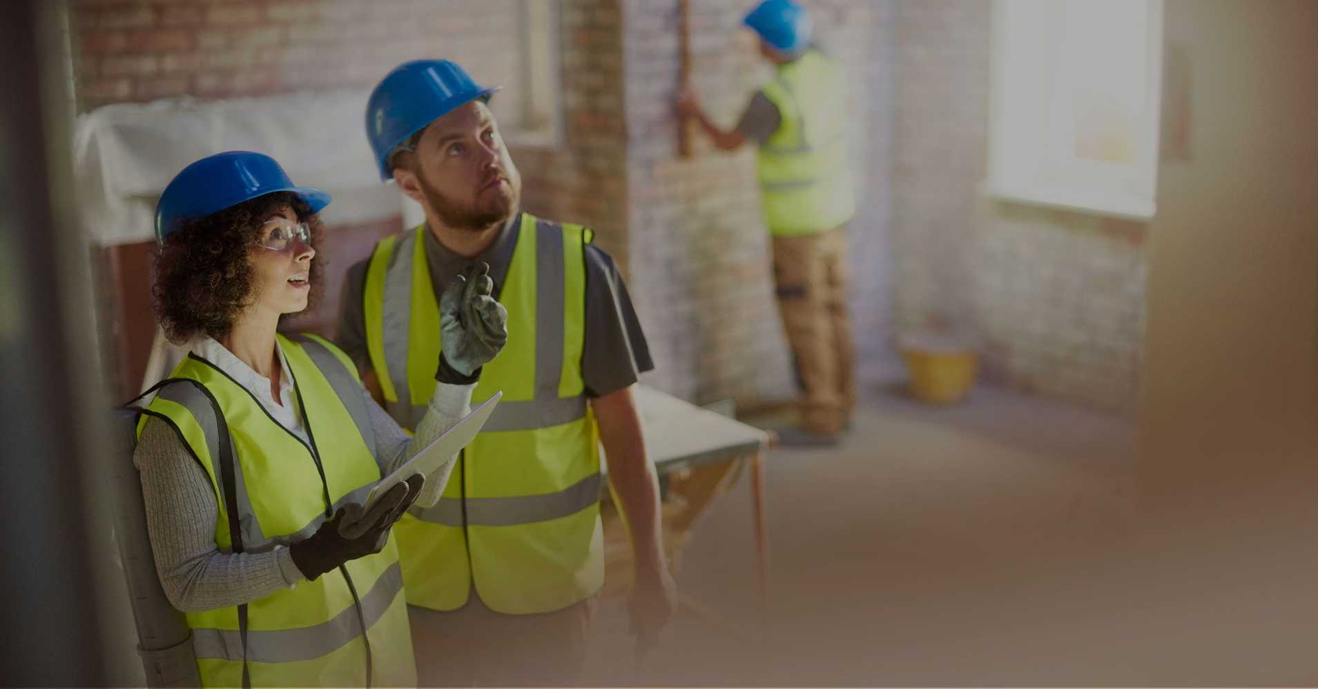 safety man and woman working in the field