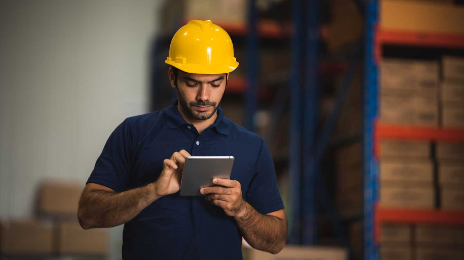 construction team member looking at tablet