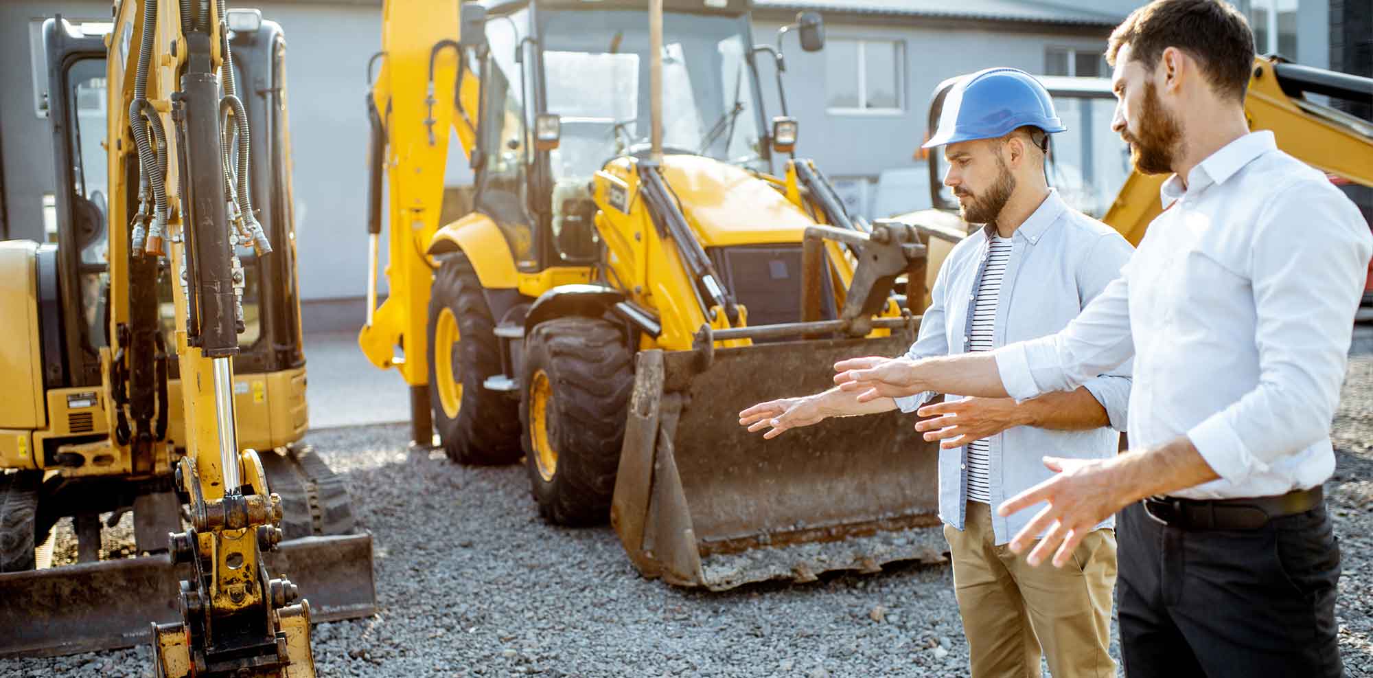 two men managing heavy equipment